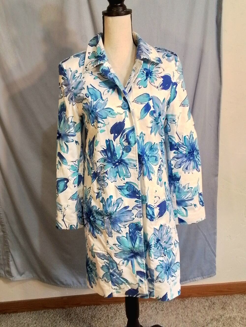 Bernardo white fall weather coat with blue flowers.